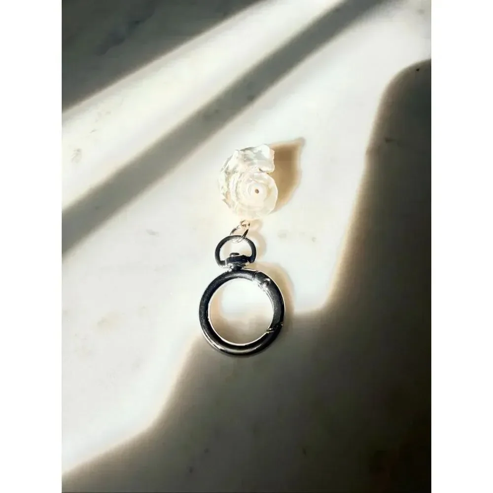 Pearlescent with silver color seashell keychain
